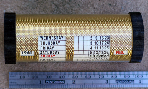 A PLASTIC DESK CALLENDAR FOR A DESK BASE